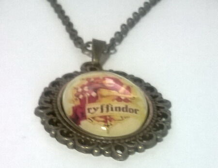 Медальон Harry Potter Gryffindor  4х3 см. Медальон Harry Potter Gryffindor  4х3 см.